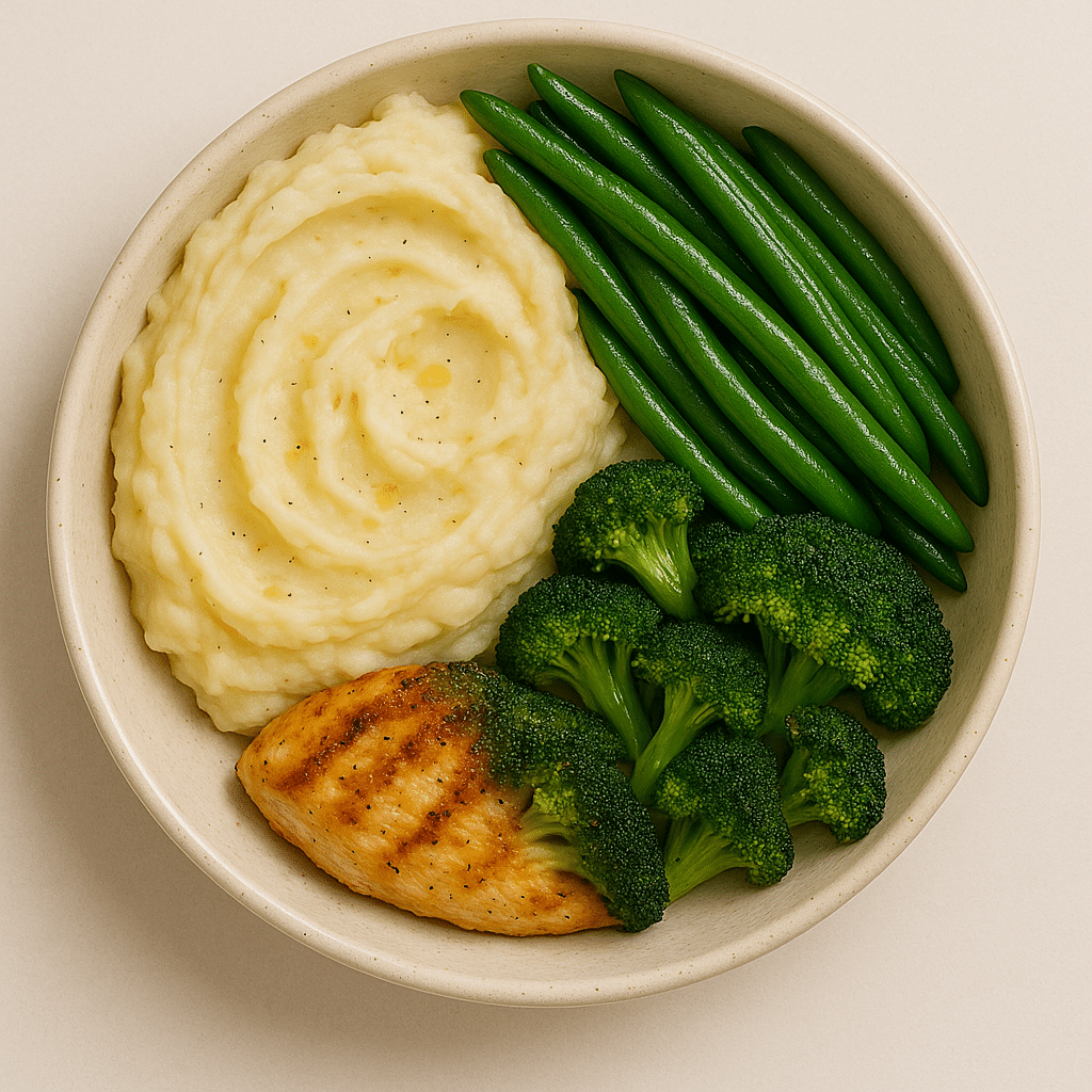 Side dish assortment with mashed potatoes, green beans, broccoli, and a portion of grilled chicken.